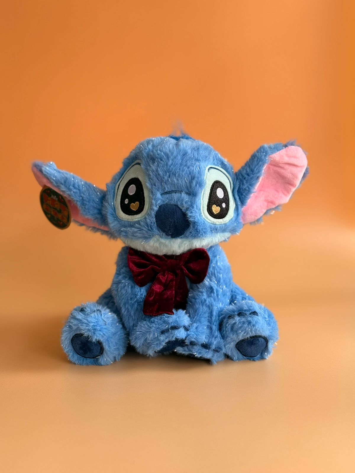 Stitch brillante con moño 23 cm 31447